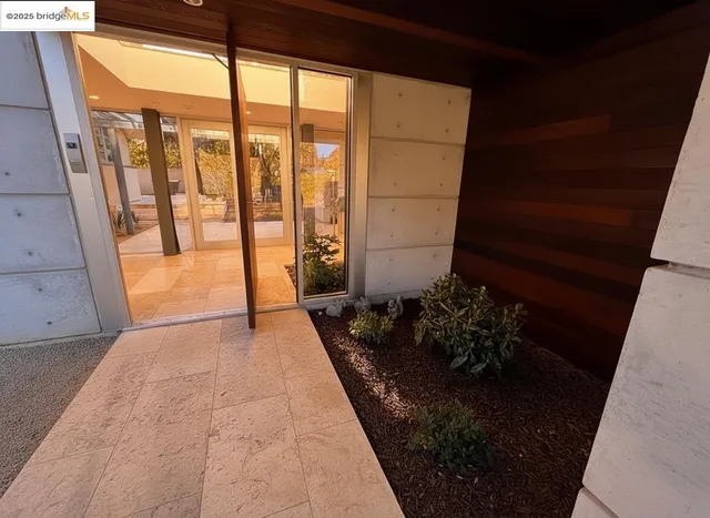a view of a balcony with chairs