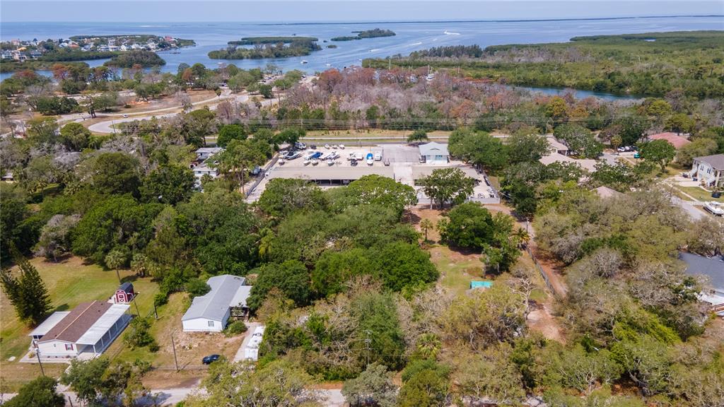 1810 Cemetery Road Holiday, FL 34691 - Photo 14 of 15 an aerial view of a houses with a green yard