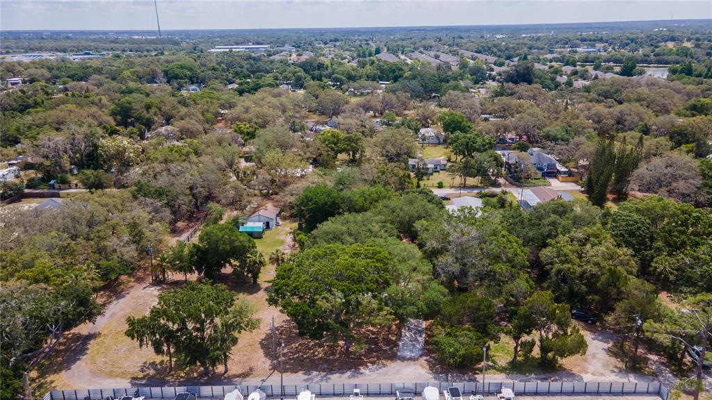 1810 Cemetery Road Holiday, FL 34691 - Photo 15 of 15 an aerial view of a houses with a yard and mountain