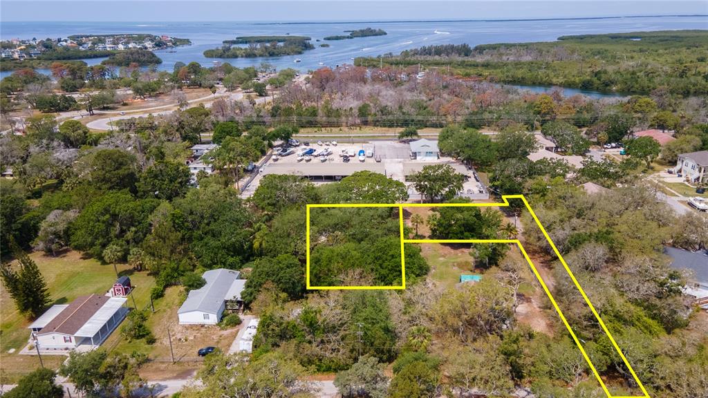 1810 Cemetery Road Holiday, FL 34691 - Photo 3 of 15 an aerial view of house with a yard
