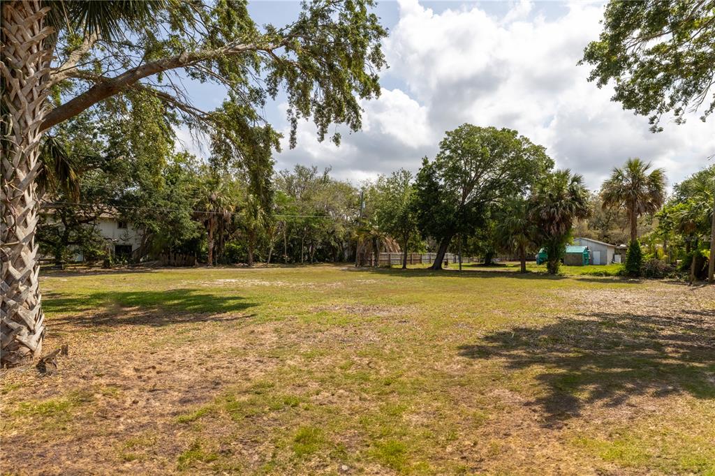 1810 Cemetery Road Holiday, FL 34691 - Photo 6 of 15 a view of a swimming pool with an outdoor space and seating area