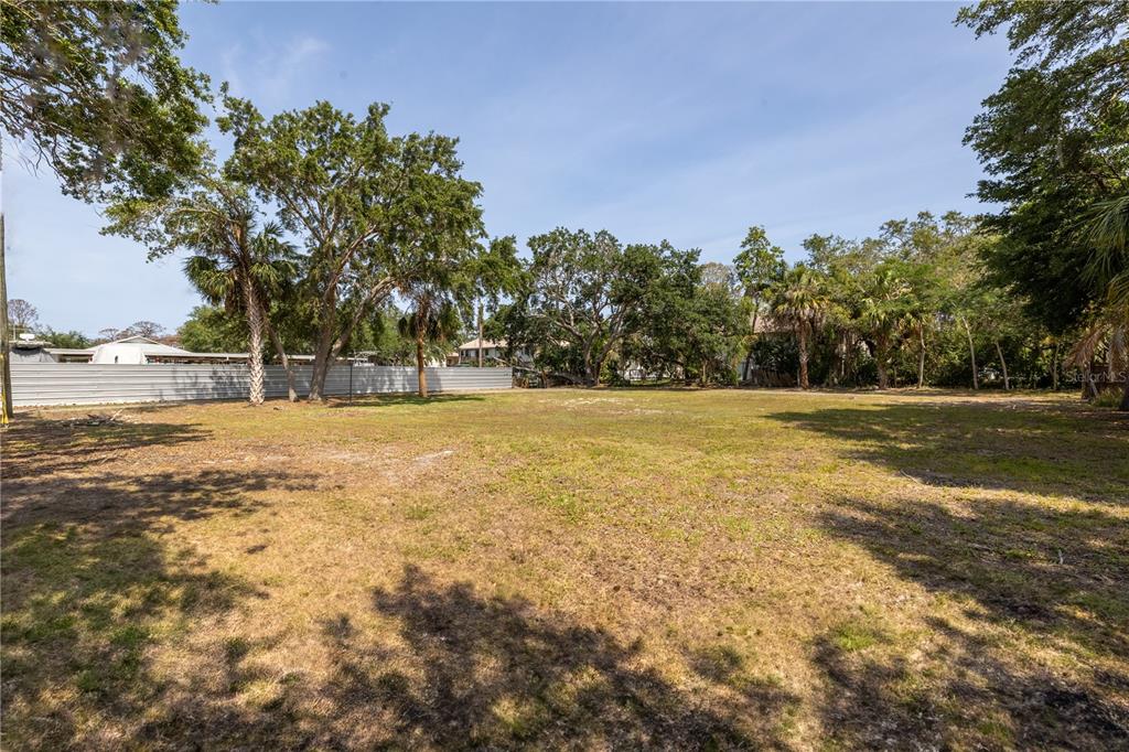 1810 Cemetery Road Holiday, FL 34691 - Photo 7 of 15 a swimming pool with trees in the background