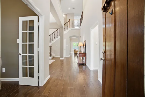 a view of a dining room with furniture and wooden floor