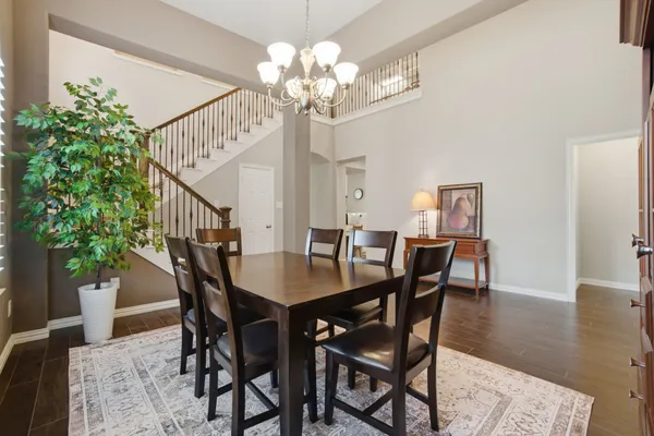 a living room with furniture kitchen view and a fireplace
