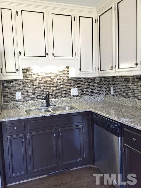 1608 Spennymore Road Raleigh, NC 27603 - Photo 13 of 25 a bathroom with granite countertop a sink and a vanity