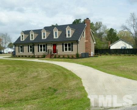1608 Spennymore Road Raleigh, NC 27603 - Photo 3 of 25 a front view of a house with a garden
