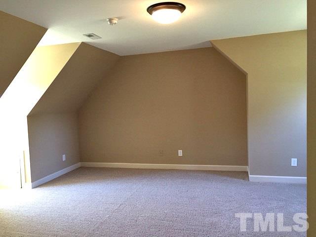 1608 Spennymore Road Raleigh, NC 27603 - Photo 24 of 25 an empty room with a workbench