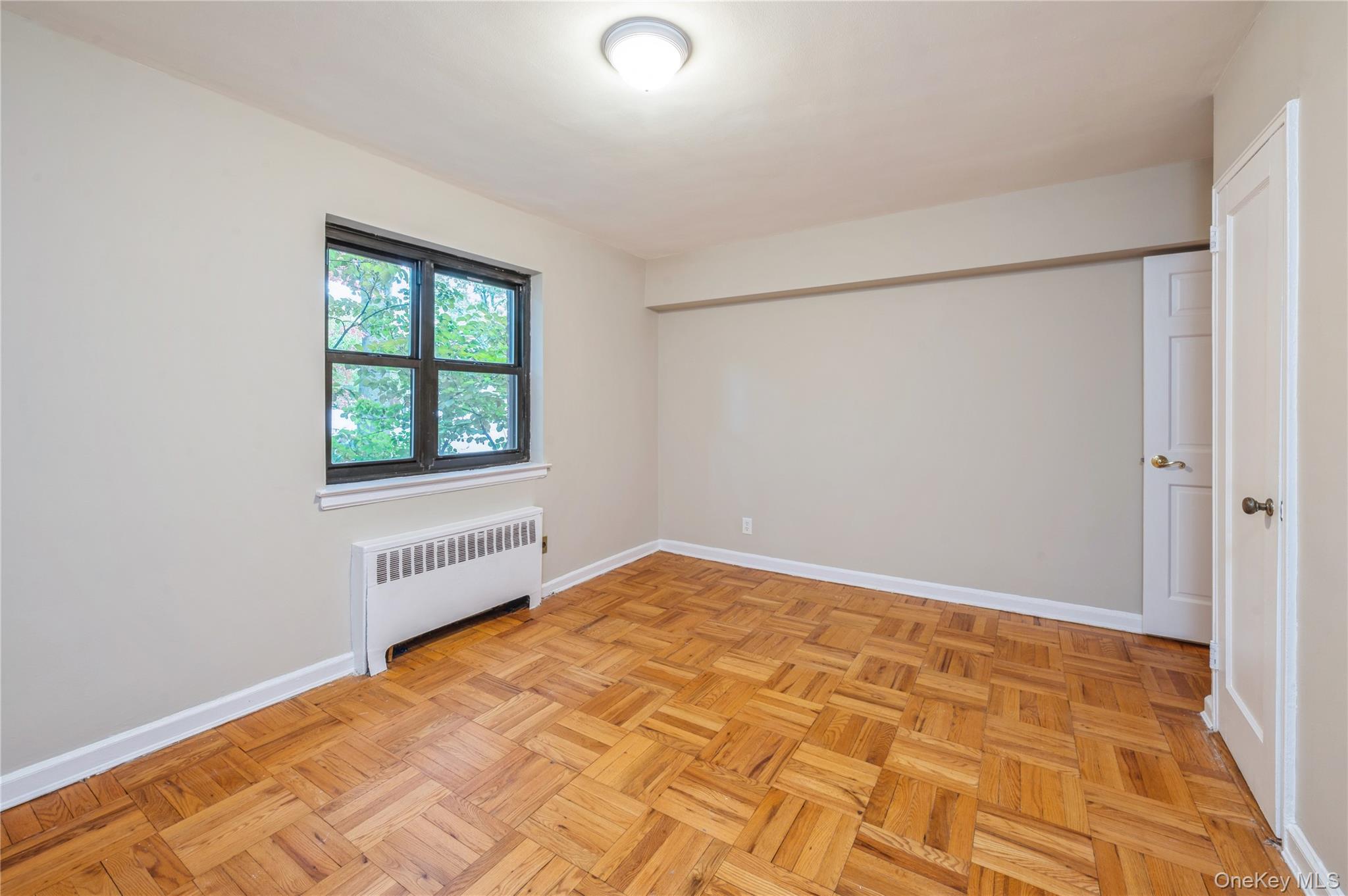 50 White Oak Street, Unit 1E New Rochelle, NY 10801 - Photo 13 of 19 an empty room with windows