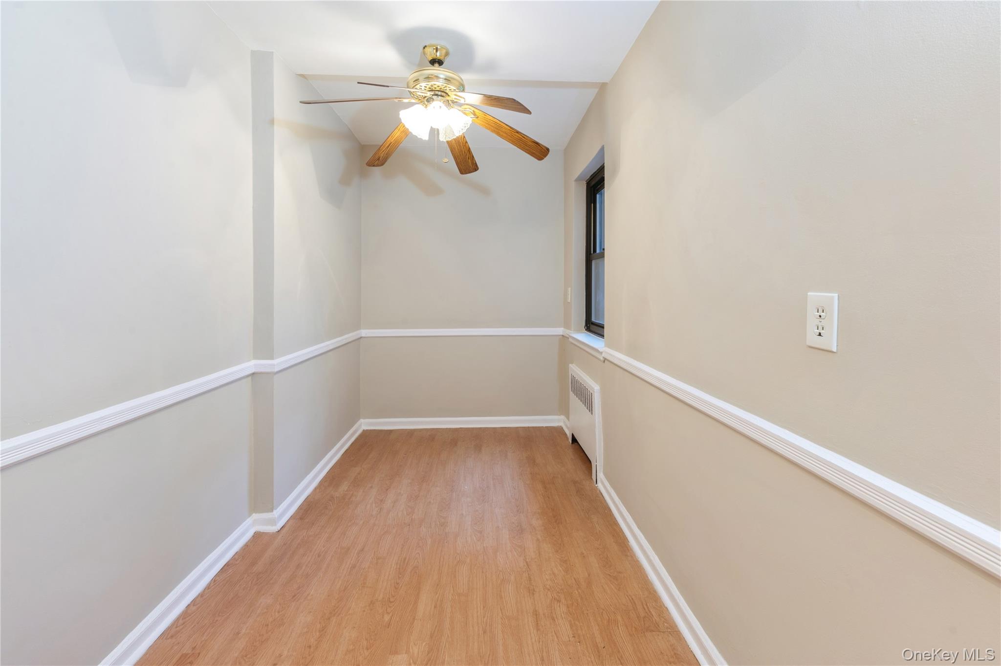 50 White Oak Street, Unit 1E New Rochelle, NY 10801 - Photo 17 of 19 a view of a hallway with wooden floor