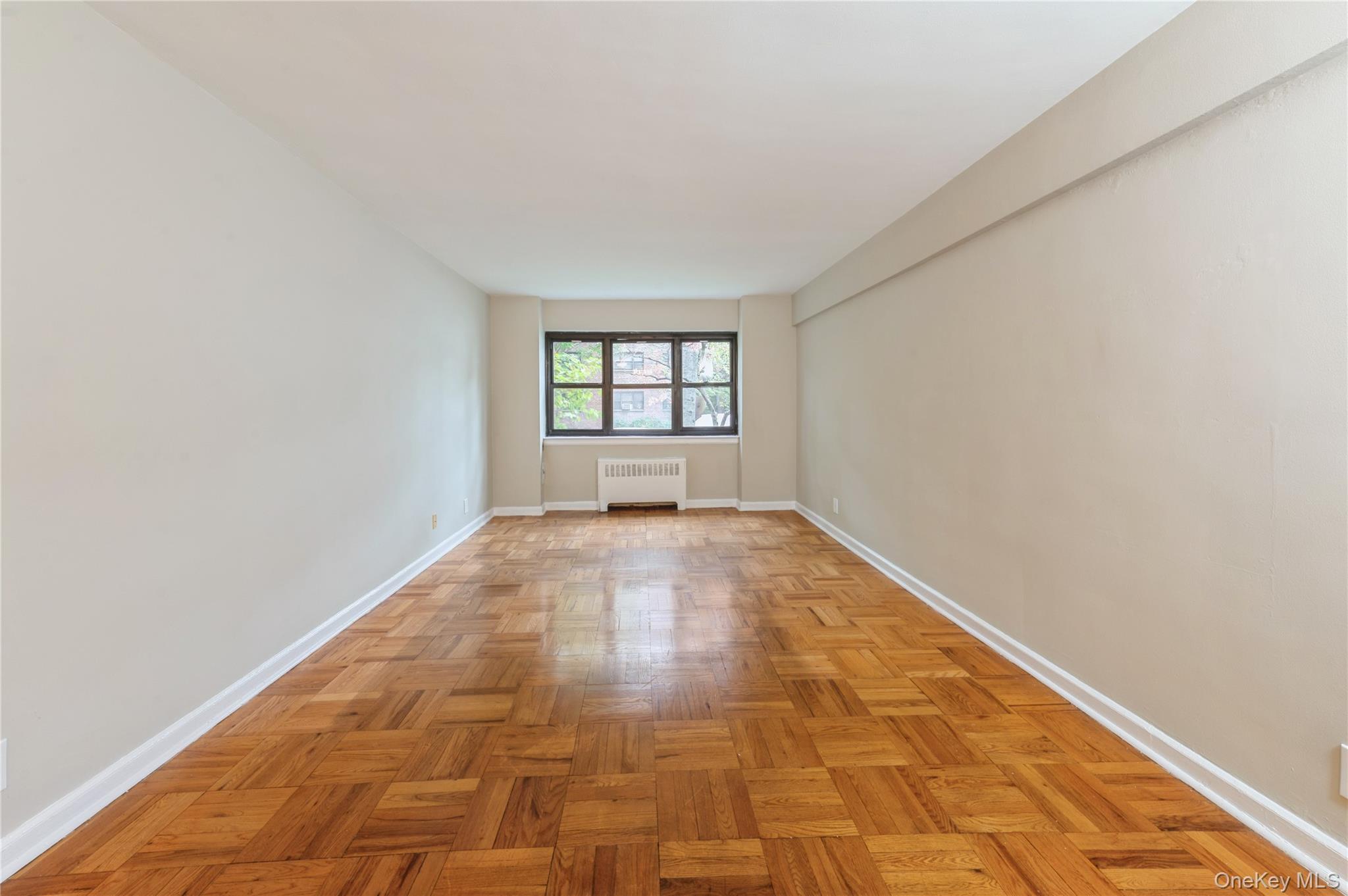50 White Oak Street, Unit 1E New Rochelle, NY 10801 - Photo 5 of 19 a view of empty room with window