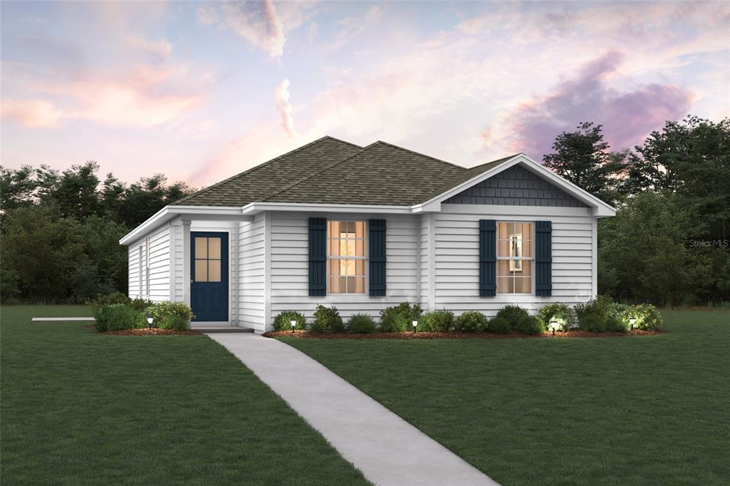 5527 Mahogany Boulevard Bunnell, FL 32110 - Photo 1 of 2 a front view of a house with a garden