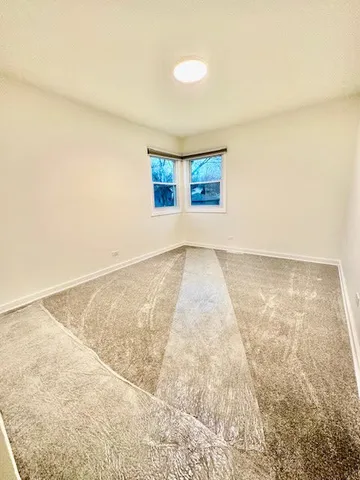 an empty room with a empty space and window