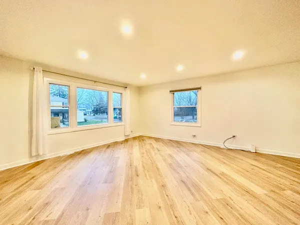 a view of an empty room and window