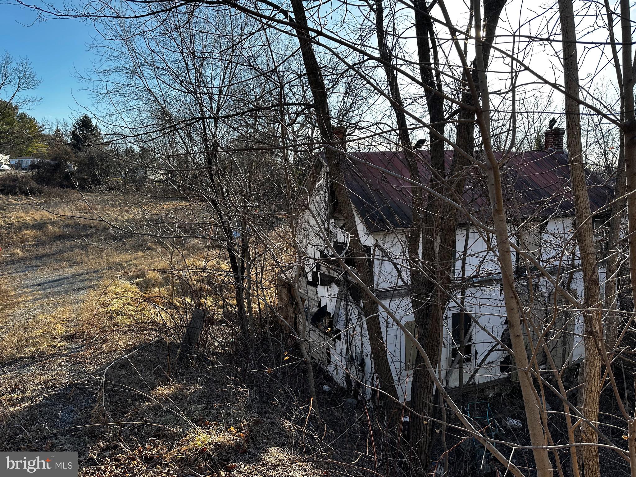 2613 Liberty Road New Windsor, MD 21776 - Photo 3 of 5 a backyard of a house with lots of trees