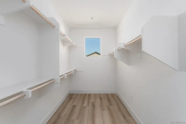 a view of a room with window wooden floor and windows