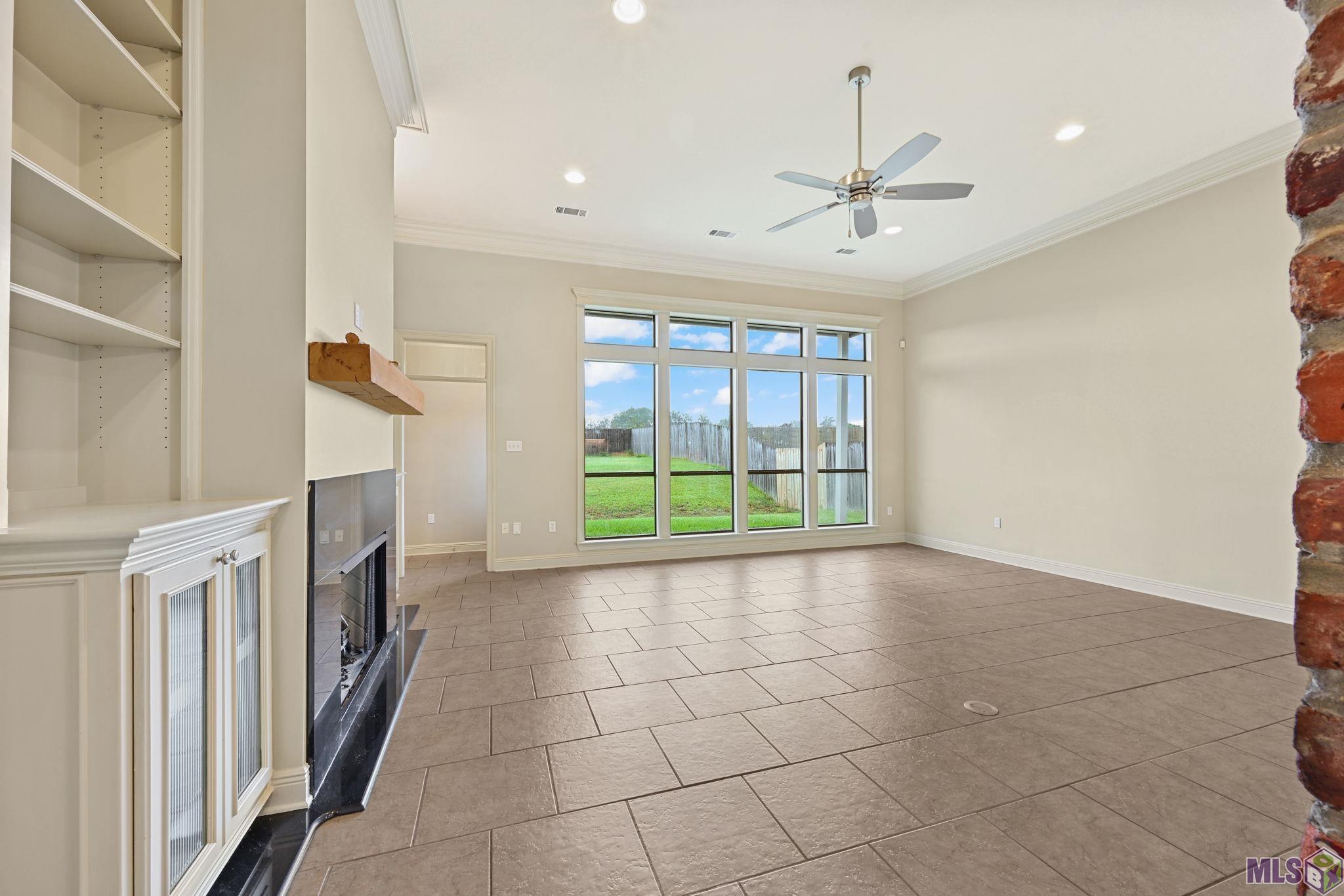 8926 Foxgate Drive St. George, LA 70809 - Photo 4 of 16 FAMILY ROOM W/ PICTURE WINDOW