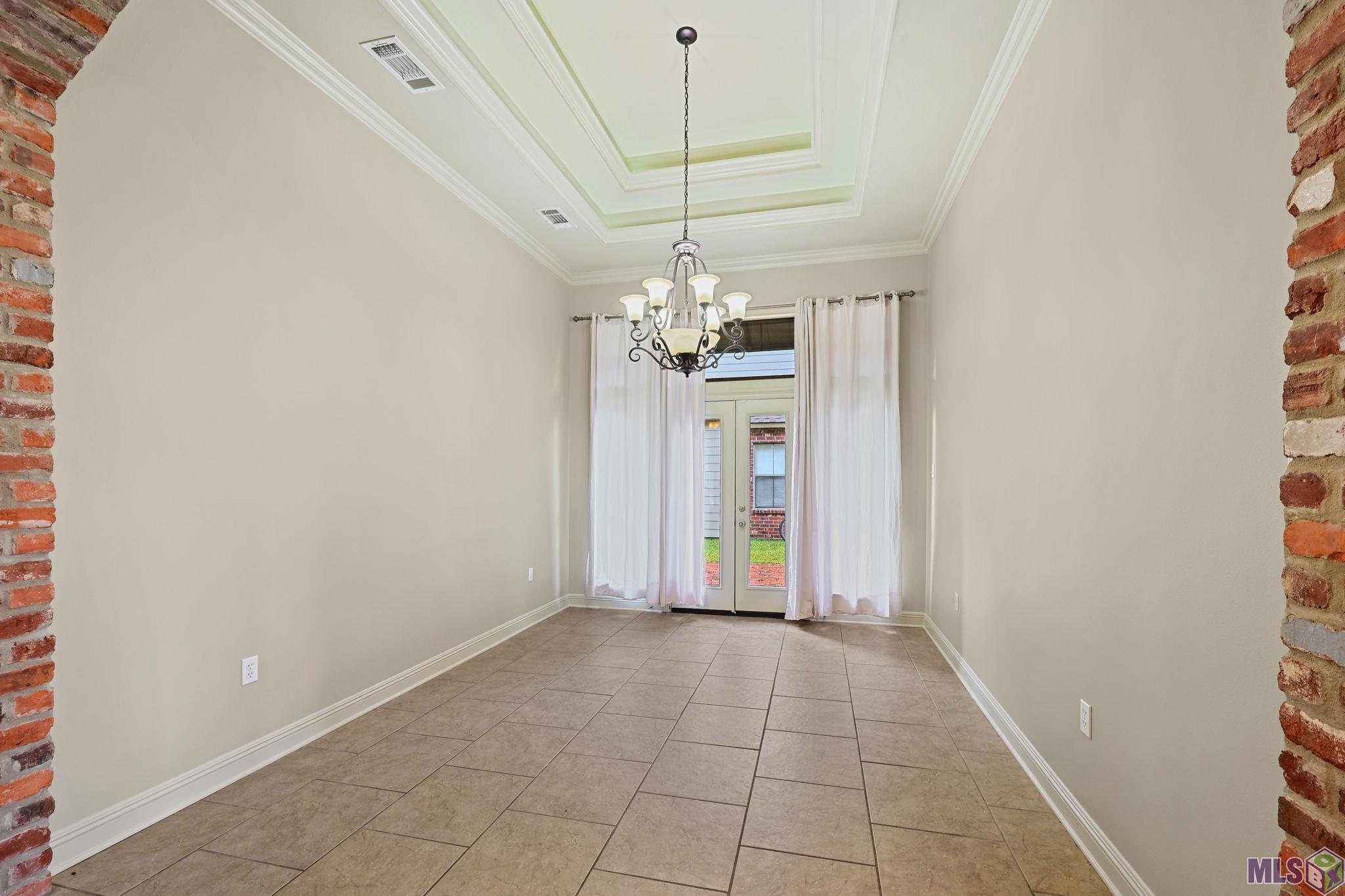 8926 Foxgate Drive St. George, LA 70809 - Photo 10 of 16 DINING ROOM W/ ELEGANT TRAYED CEILING