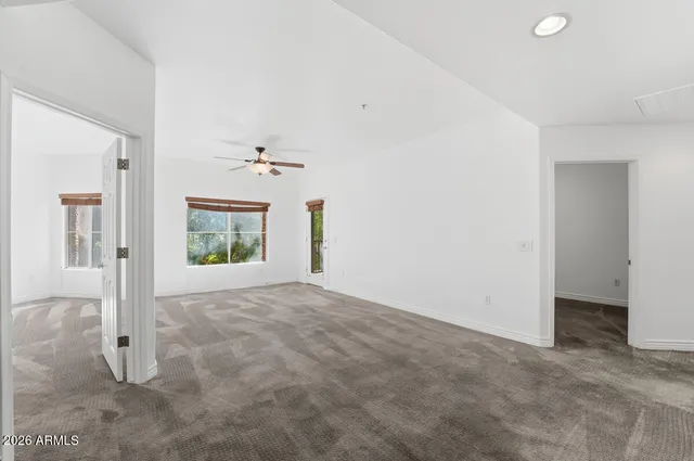 an empty room that has a window in it