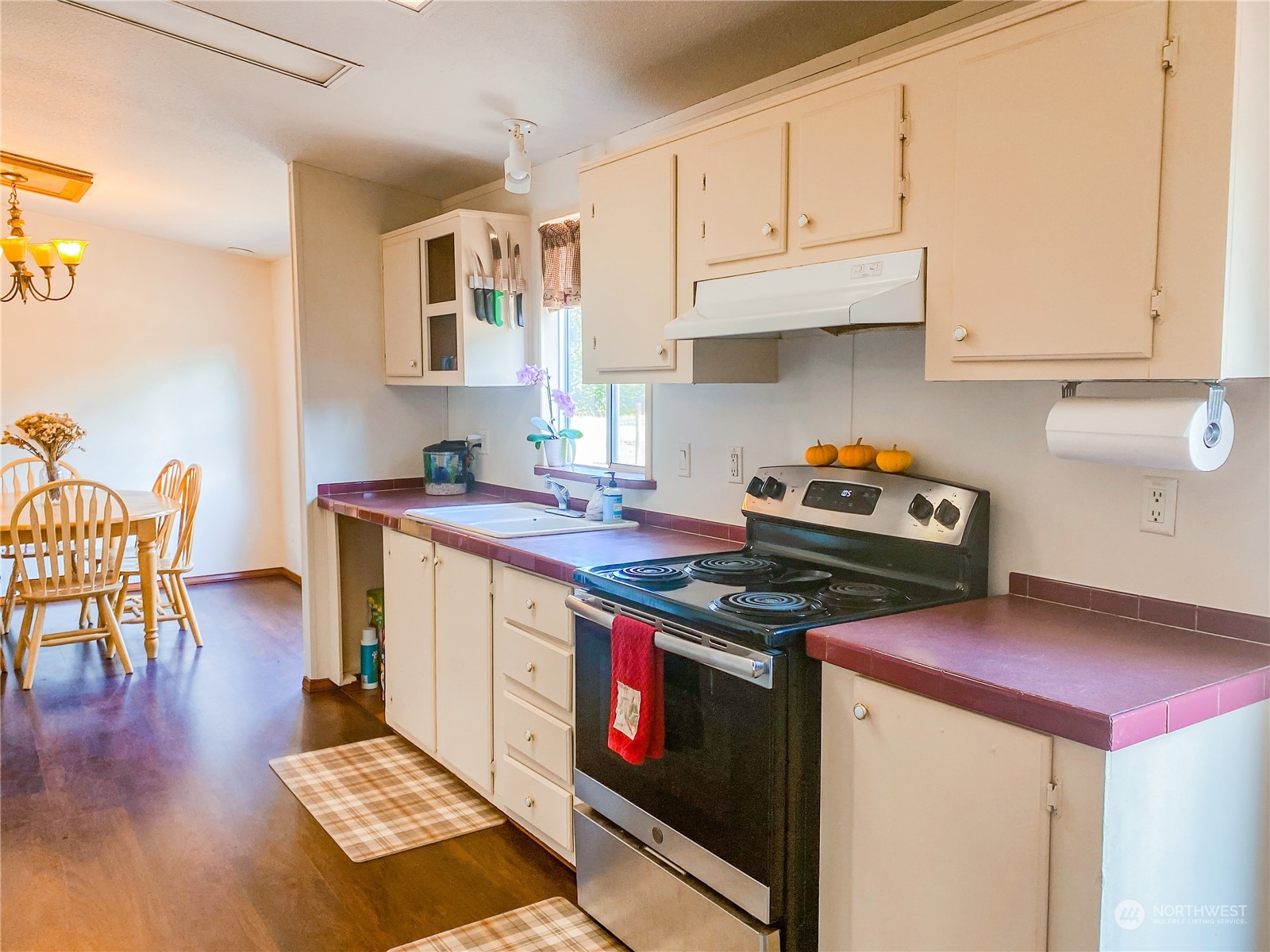 18820 Apricot Street Southwest Rochester, WA 98579 - Photo 4 of 38 a kitchen with stainless steel appliances granite countertop a stove a sink and a white cabinets