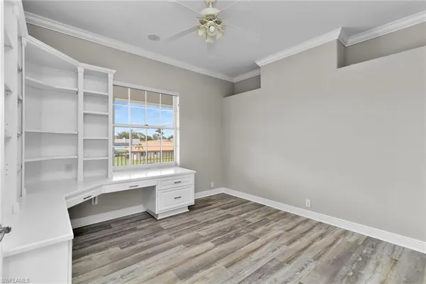 a room with a wooden floor and window