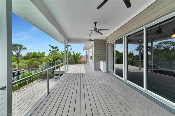 a view of a balcony with wooden floor