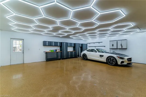 an aerial view of a house with yard swimming pool and outdoor seating