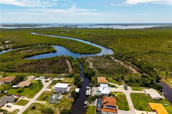 a view of a livingroom with a fireplace wooden floor and furniture