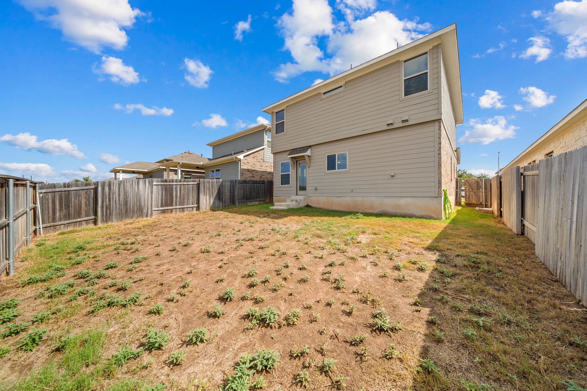 436 Spinnaker Loop Kyle, TX 78640 - Photo 12 of 14 a backyard of a house