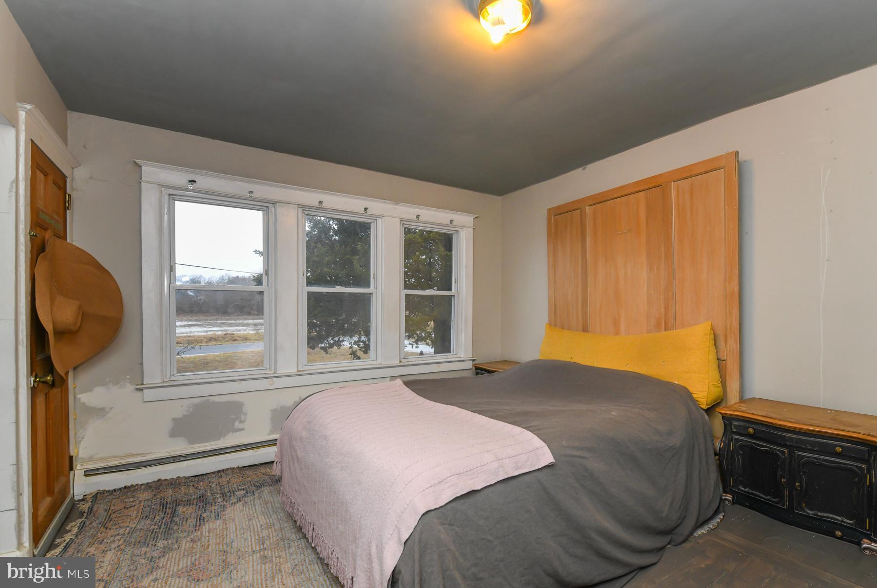 2270 Harding Highway Newfield, NJ 08344 - Photo 11 of 13 a bedroom with a bed and a window