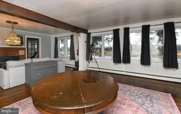 a view of a living room and chandelier