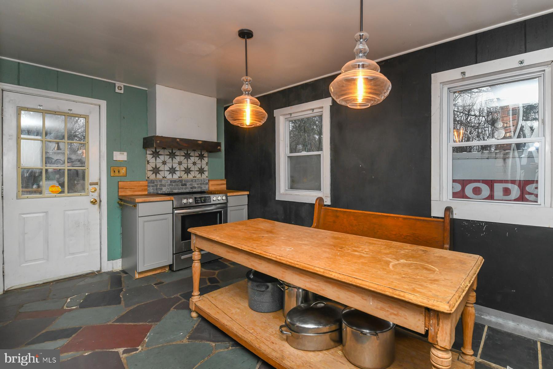 2270 Harding Highway Newfield, NJ 08344 - Photo 4 of 13 a kitchen with stainless steel appliances granite countertop a stove a sink and a refrigerator