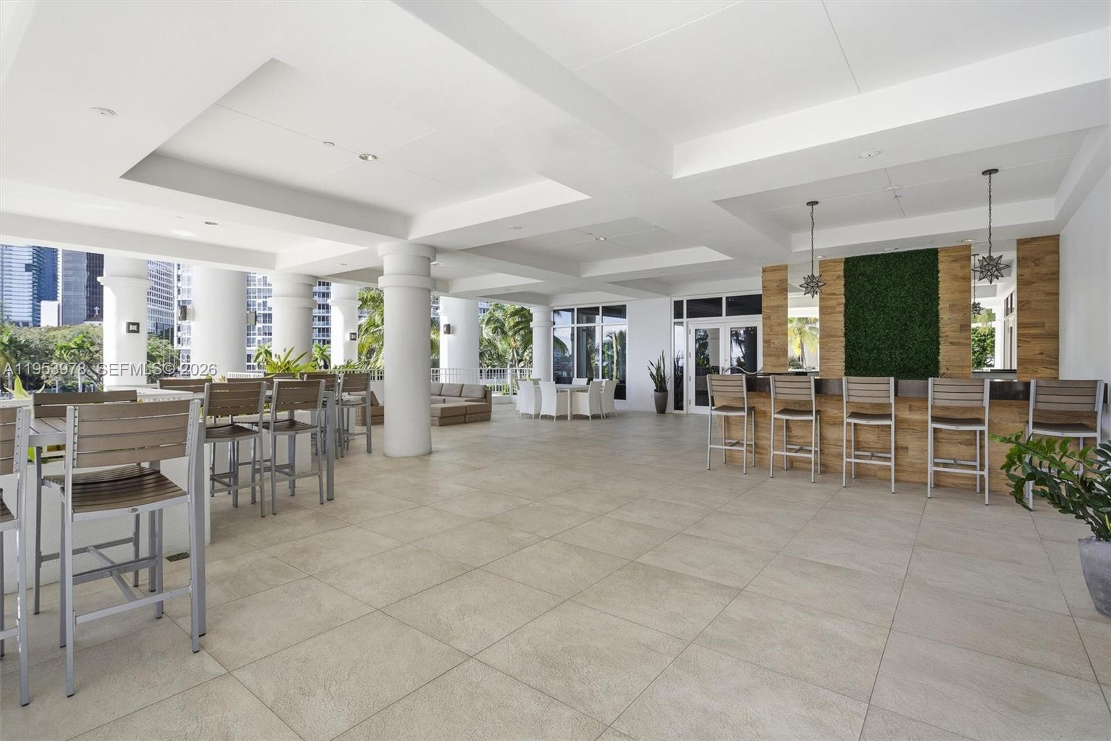 801 Brickell Key Boulevard, Unit 1404 Miami, FL 33131 - Photo 32 of 44 a room with lots of furniture and a view of dining room