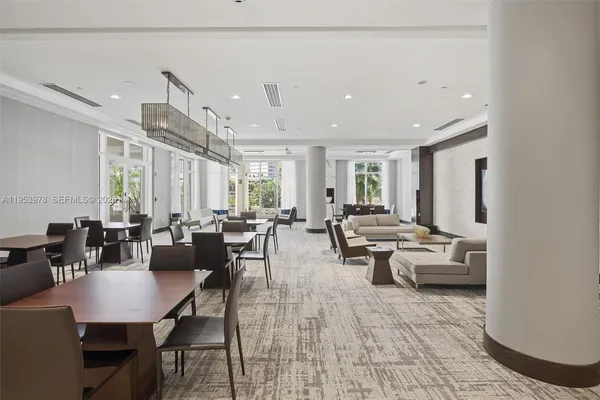 a living room with lots of furniture and a table