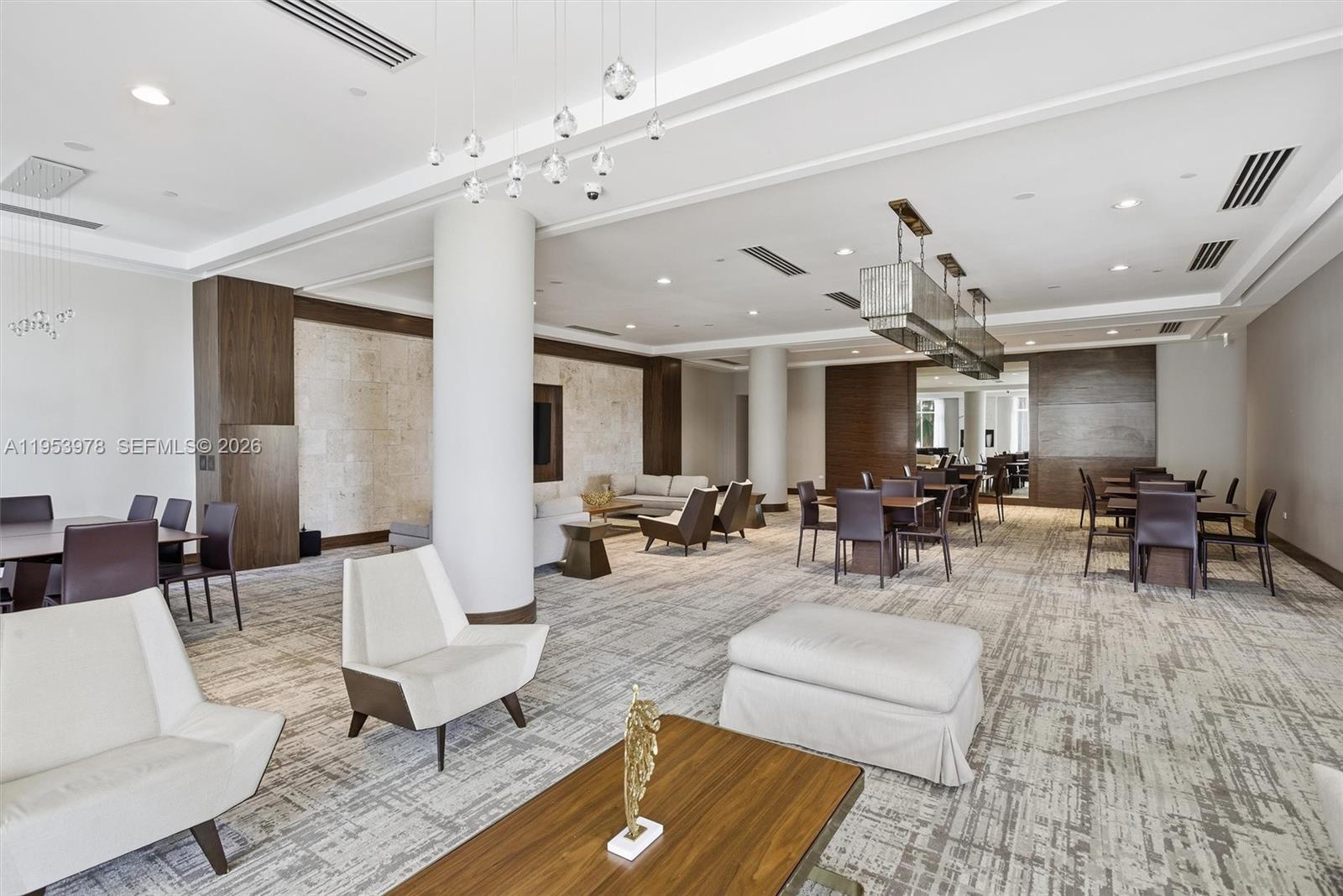 801 Brickell Key Boulevard, Unit 1404 Miami, FL 33131 - Photo 38 of 44 a living room with furniture and view of kitchen