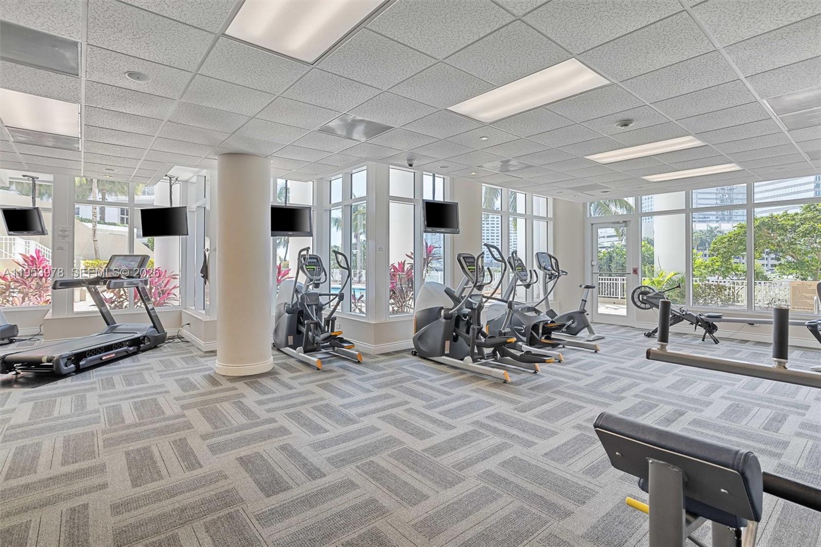 801 Brickell Key Boulevard, Unit 1404 Miami, FL 33131 - Photo 40 of 44 a view of a room with gym equipment