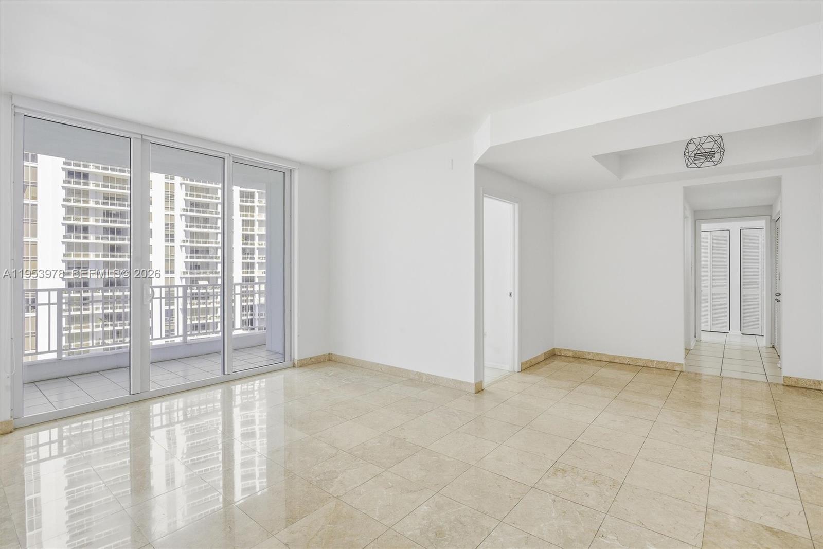 801 Brickell Key Boulevard, Unit 1404 Miami, FL 33131 - Photo 8 of 44 a view of an empty room with a window