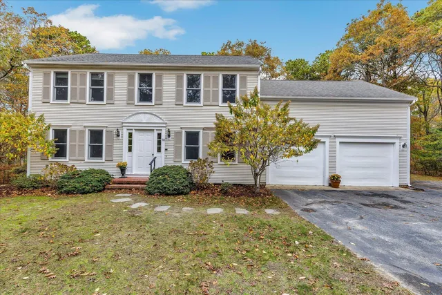 a front view of a house with a yard
