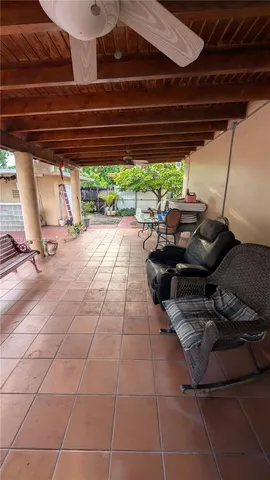 a living room with furniture a table and chairs