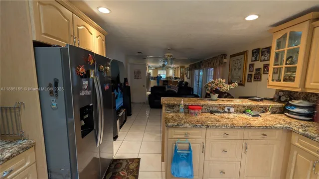 a view of a kitchen with a sink and cabinets