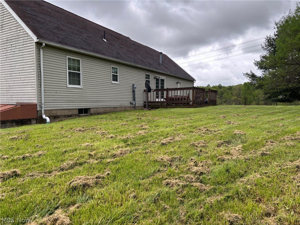 57575 Marietta Road Byesville, OH 43723 - Photo 24 of 25 Spacious rear yard with a multi-level wood deck and natural tree-lined perimeter