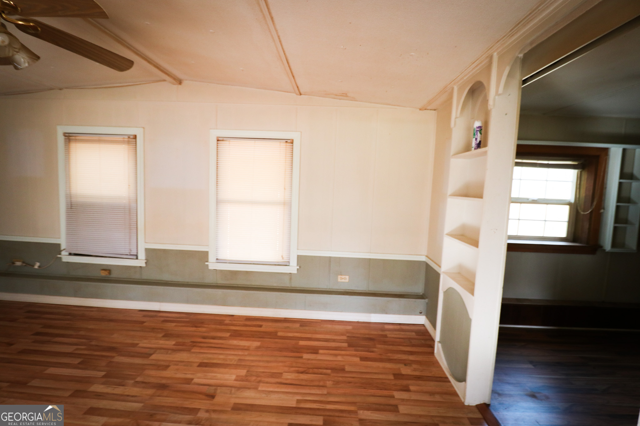 2447 Williamson Road Williamson, GA 30292 - Photo 14 of 95 a view of empty room with wooden floor and fan