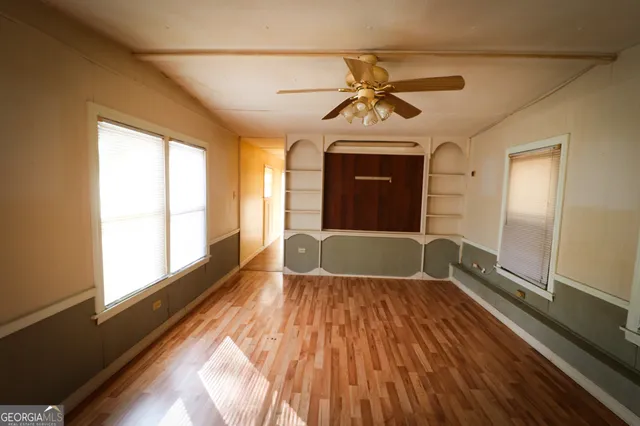a bathroom with a granite countertop toilet and a shower