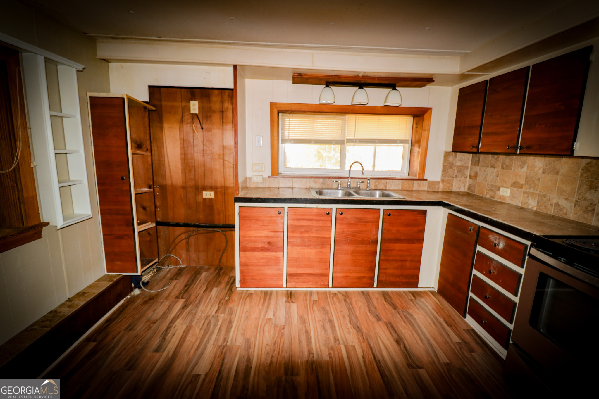 2447 Williamson Road Williamson, GA 30292 - Photo 22 of 95 an empty room with wooden floor and windows