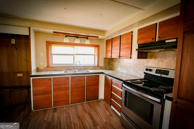 a backyard of a house with lots of green space