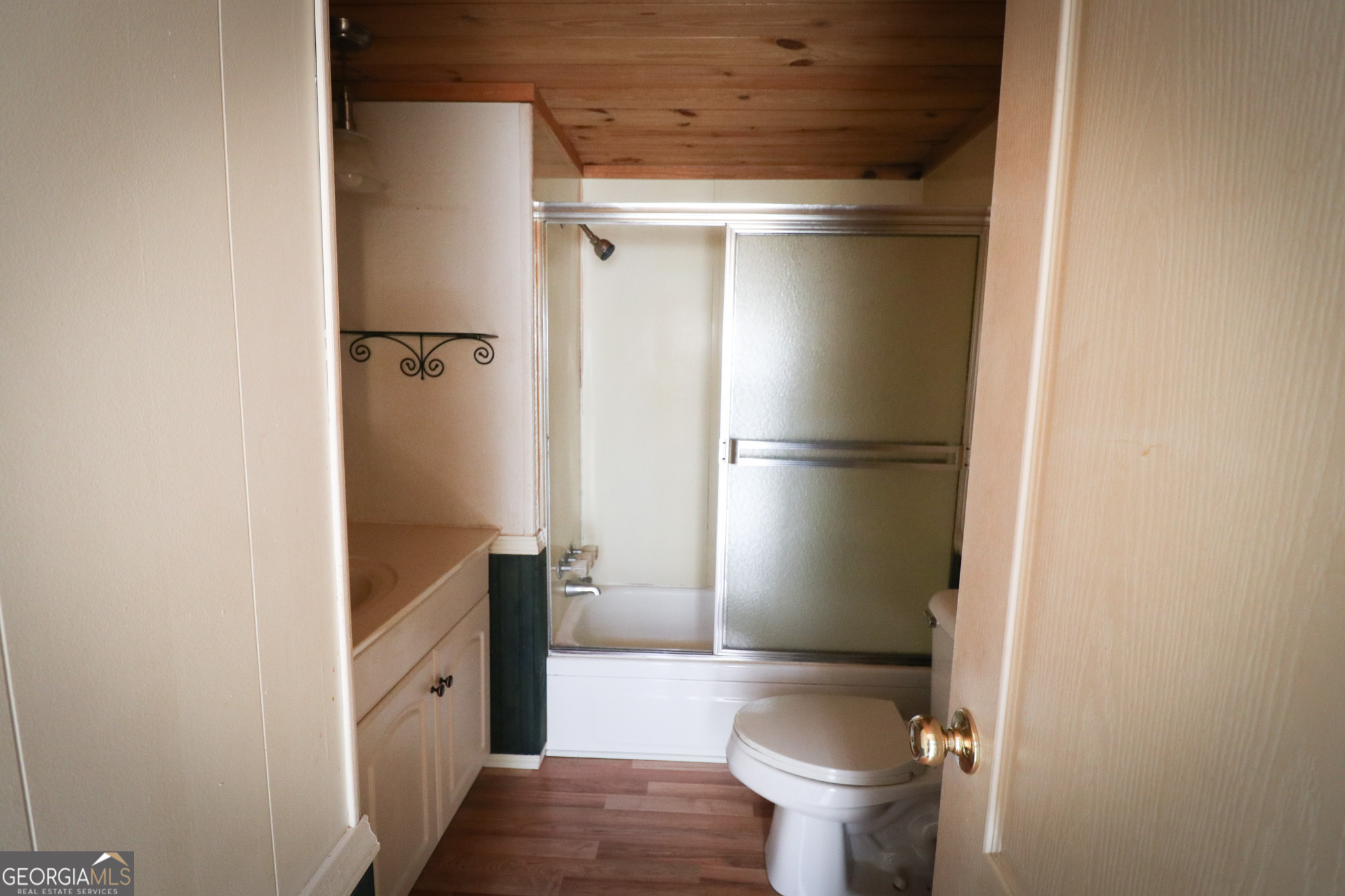 2447 Williamson Road Williamson, GA 30292 - Photo 29 of 95 a bathroom with a granite countertop toilet and a shower