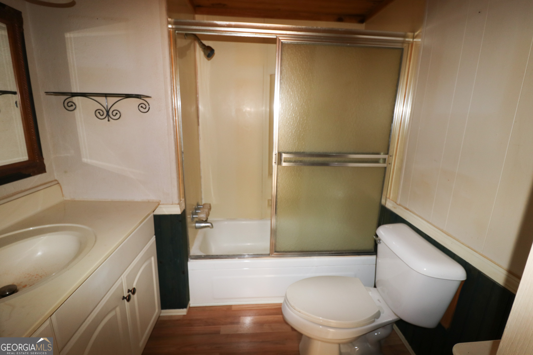 2447 Williamson Road Williamson, GA 30292 - Photo 31 of 95 a bathroom with a granite countertop bathtub shower sink mirror and toilet