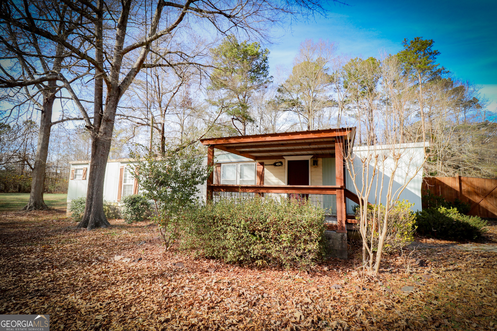2447 Williamson Road Williamson, GA 30292 - Photo 44 of 95 a backyard of a house with lots of green space