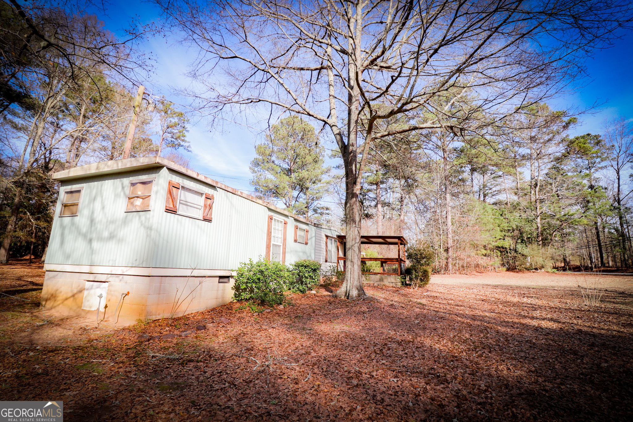 2447 Williamson Road Williamson, GA 30292 - Photo 56 of 95 a backyard of a house with lots of green space and fountain