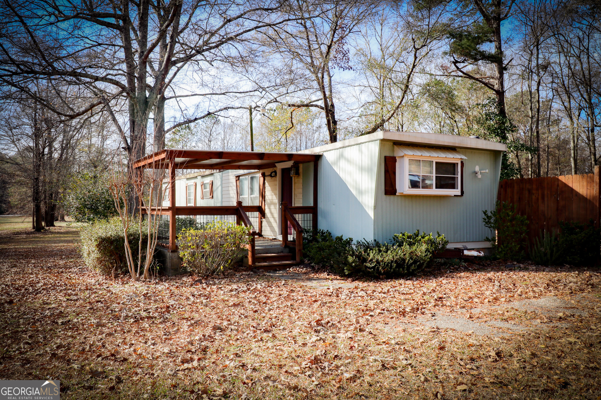 2447 Williamson Road Williamson, GA 30292 - Photo 6 of 95 a front view of a house with garden