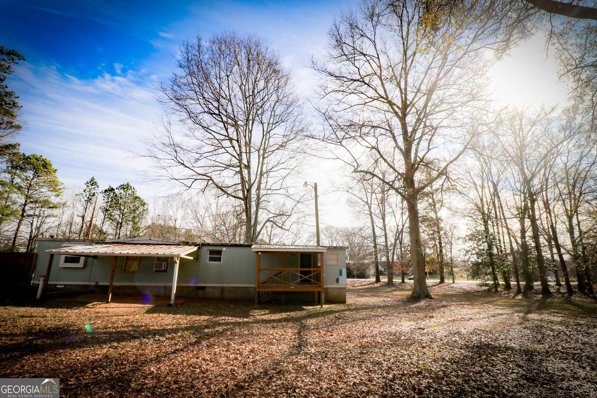 2447 Williamson Road Williamson, GA 30292 - Photo 68 of 95 a view of a house with a yard covered in snow
